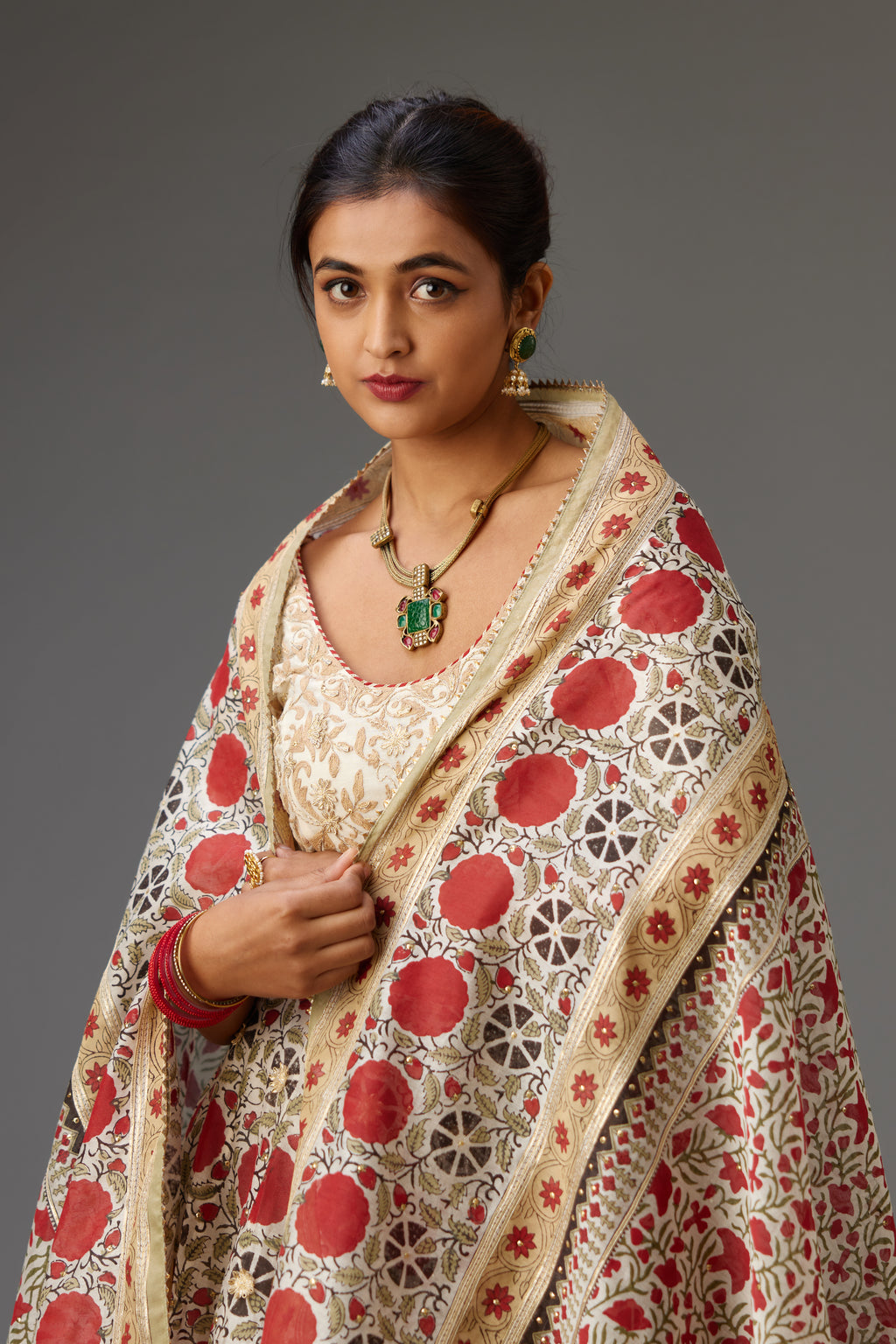 Red and off-white silk chanderi hand block printed dupatta, highlighted with gota embroidery and sequins.
