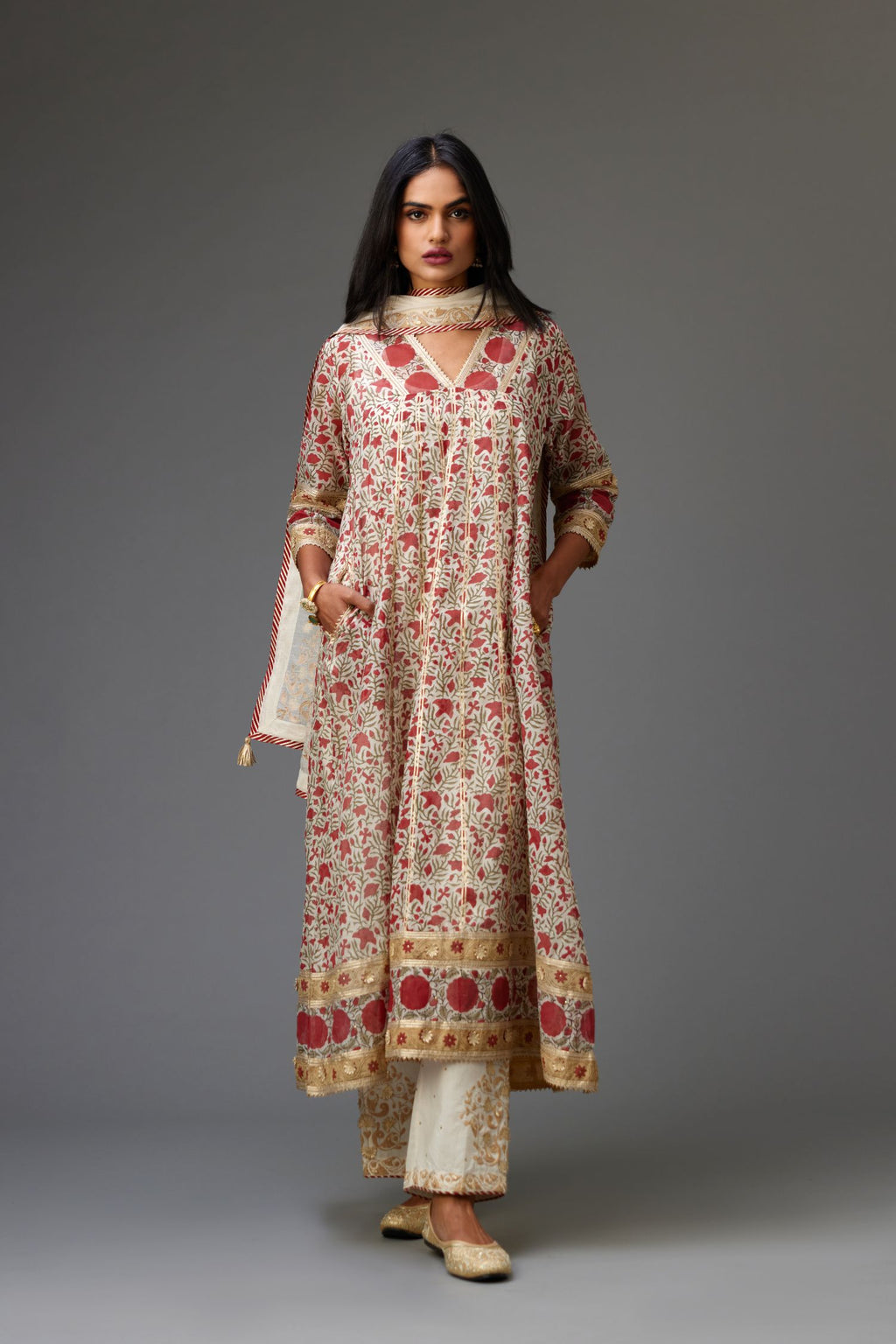 Red and off white hand block printed kurta dress set with a V neck, detailed with gota at yoke and panels.