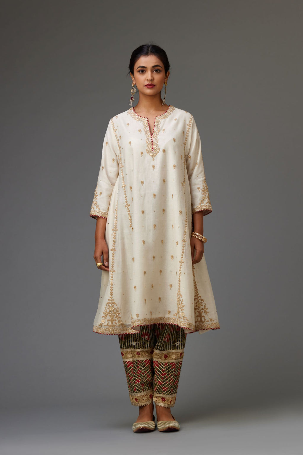 Off white cotton chanderi short kalidar kurta set with all-over delicate zari bootis.