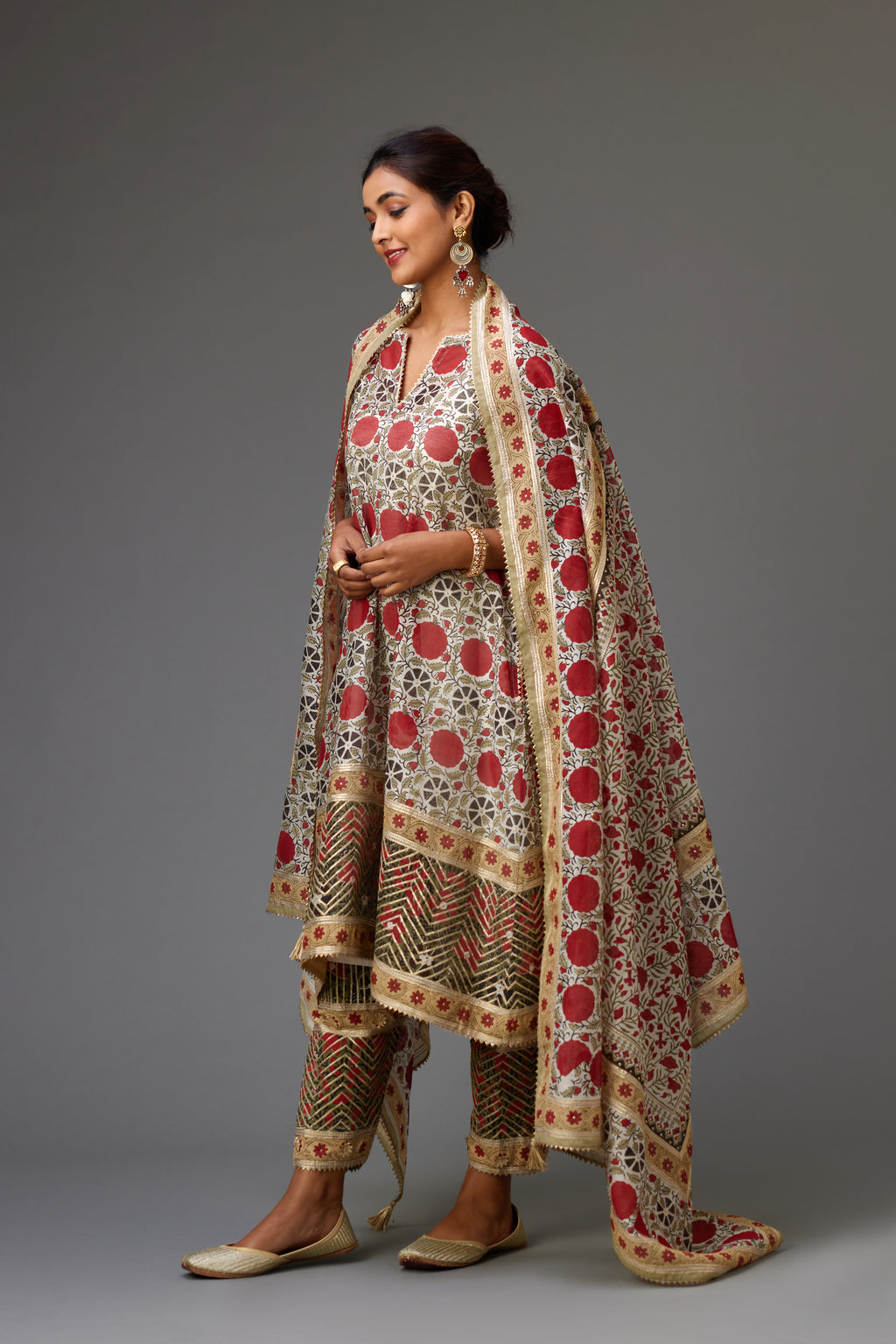Red and off-white silk chanderi hand block printed dupatta, highlighted with gota embroidery and sequins.