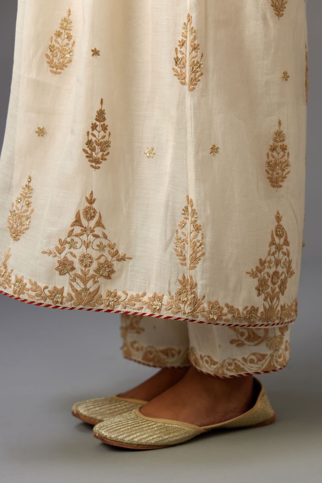 Off white cotton chanderi kurta-dress set with dori and gota embroidery, highlighted with gold sequins work.