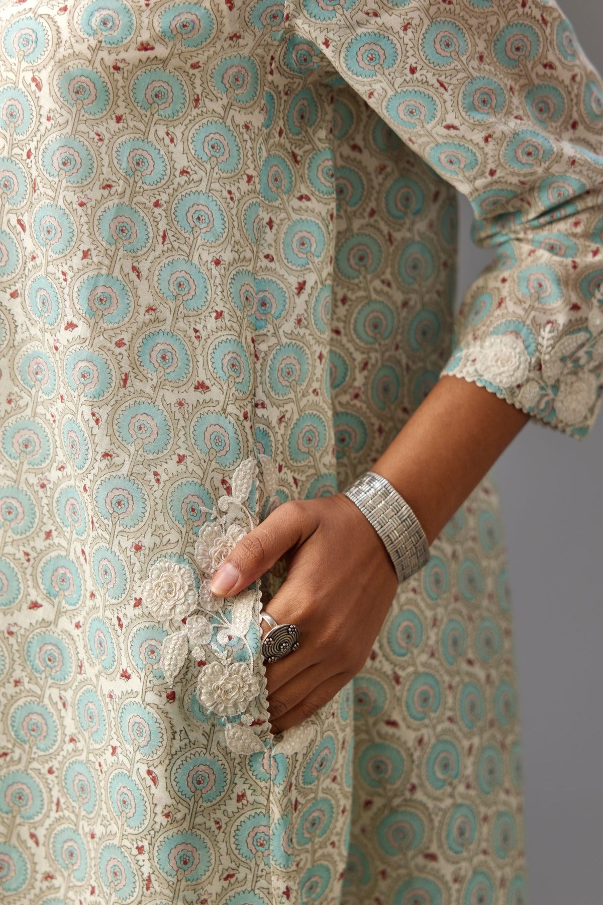 Blue & grey hand block printed short A-line kurta set with appliqué embroidery, highlighted with ric rac lace and sequins.