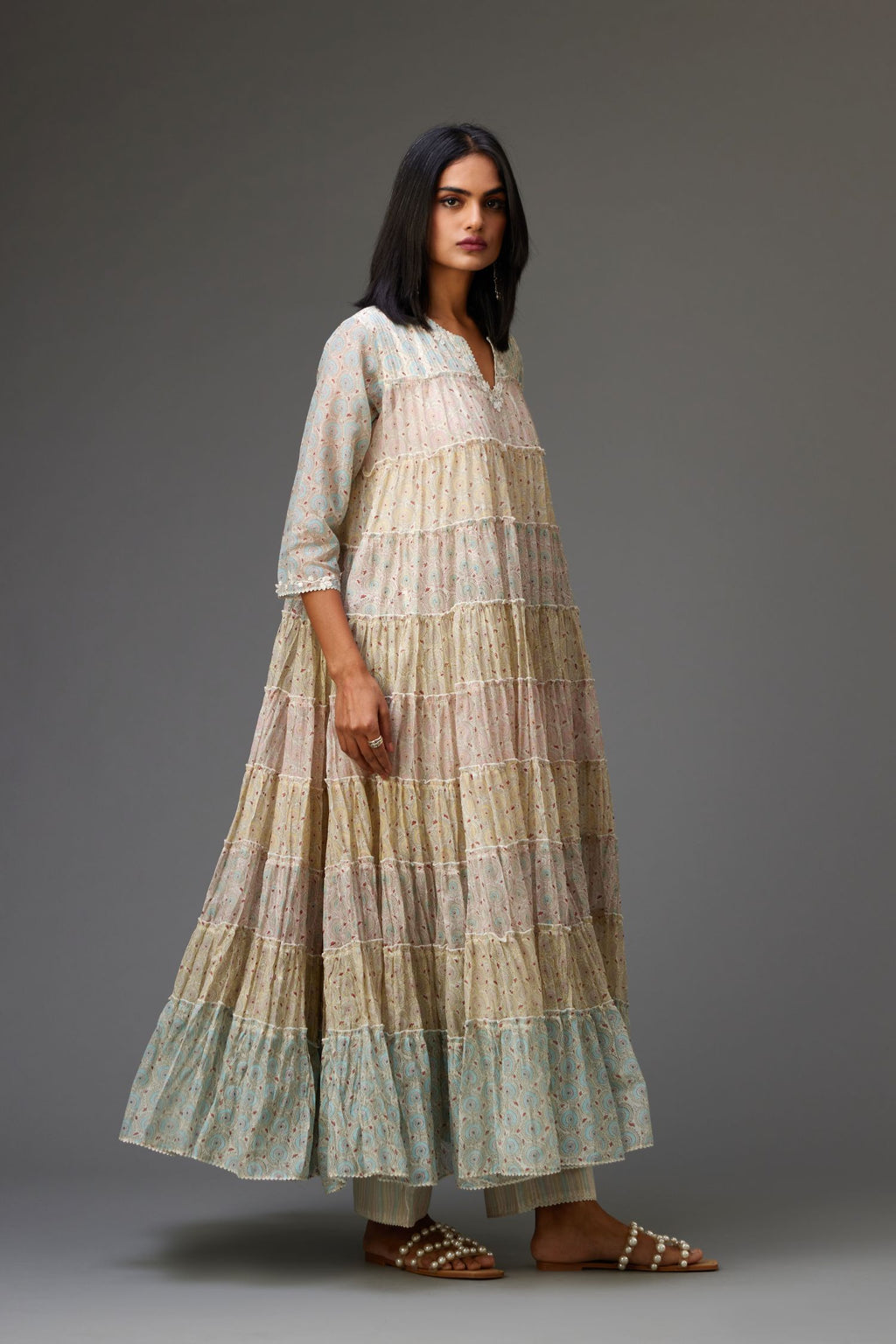 Mixed-print hand-block printed tiered kurta set with thread embroidery, highlighted with sequins.