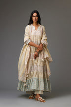 Mixed-print hand-block printed tiered kurta set with thread embroidery, highlighted with sequins.