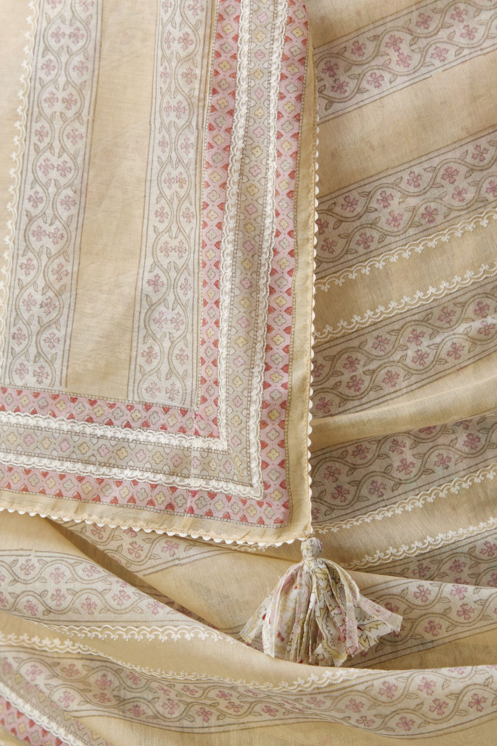 Mixed-print hand-block printed tiered kurta set with thread embroidery, highlighted with sequins.