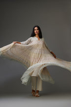 Mixed-print hand-block printed tiered kurta set with thread embroidery, highlighted with sequins.