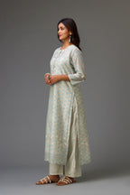 Silk chanderi hand-block printed straight kurta set with sequins work and chiffon flower embroidery.