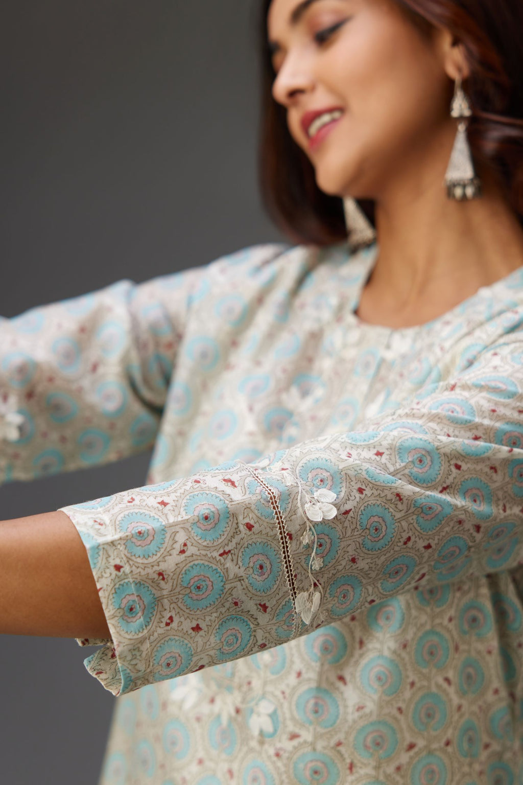 Silk chanderi hand-block printed straight kurta set with sequins work and chiffon flower embroidery.