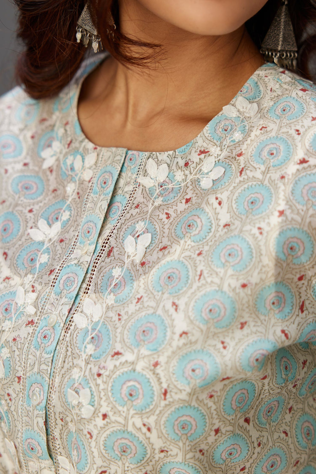 Silk chanderi hand-block printed straight kurta set with sequins work and chiffon flower embroidery.