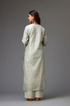 Silk chanderi hand-block printed straight kurta set with sequins work and chiffon flower embroidery.
