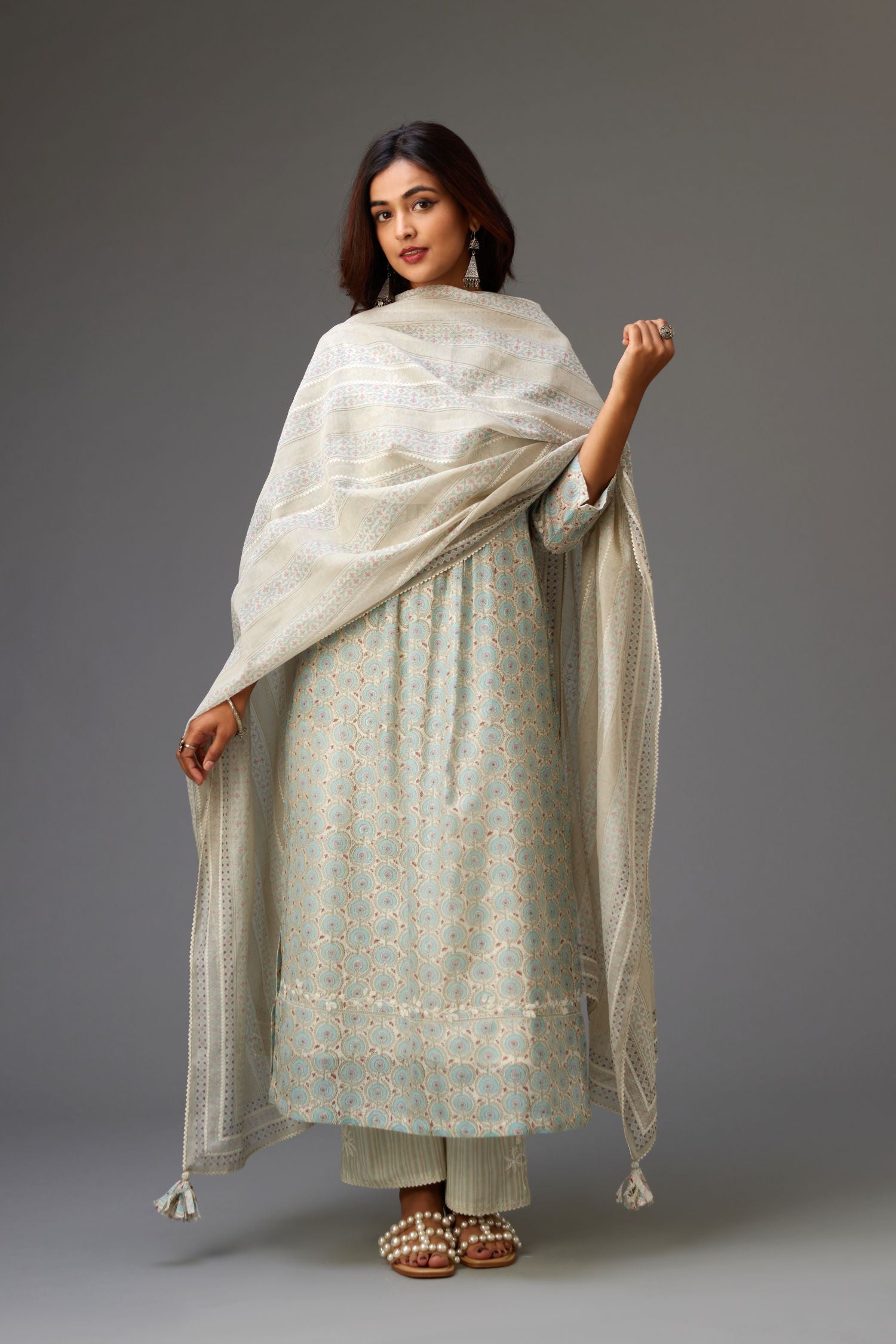 Silk chanderi blue and grey hand block printed straight kurta set highlighted with pin tucks at yoke.