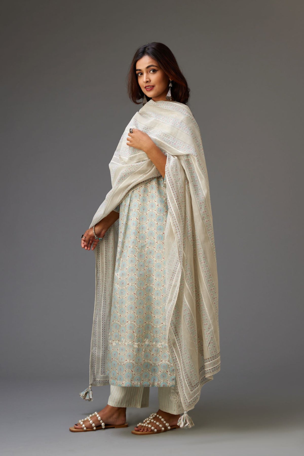 Silk chanderi blue and grey hand block printed straight kurta set highlighted with pin tucks at yoke.