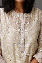 Multicolored mixed print hand-block printed straight kurta set with thread embroidery and chiffon flower buds at edges, highlighted with ric-rac lace.