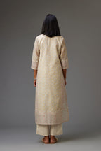 Multicolored mixed print hand-block printed straight kurta set with thread embroidery and chiffon flower buds at edges, highlighted with ric-rac lace.