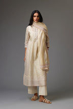 Multicolored mixed print hand-block printed straight kurta set with thread embroidery and chiffon flower buds at edges, highlighted with ric-rac lace.