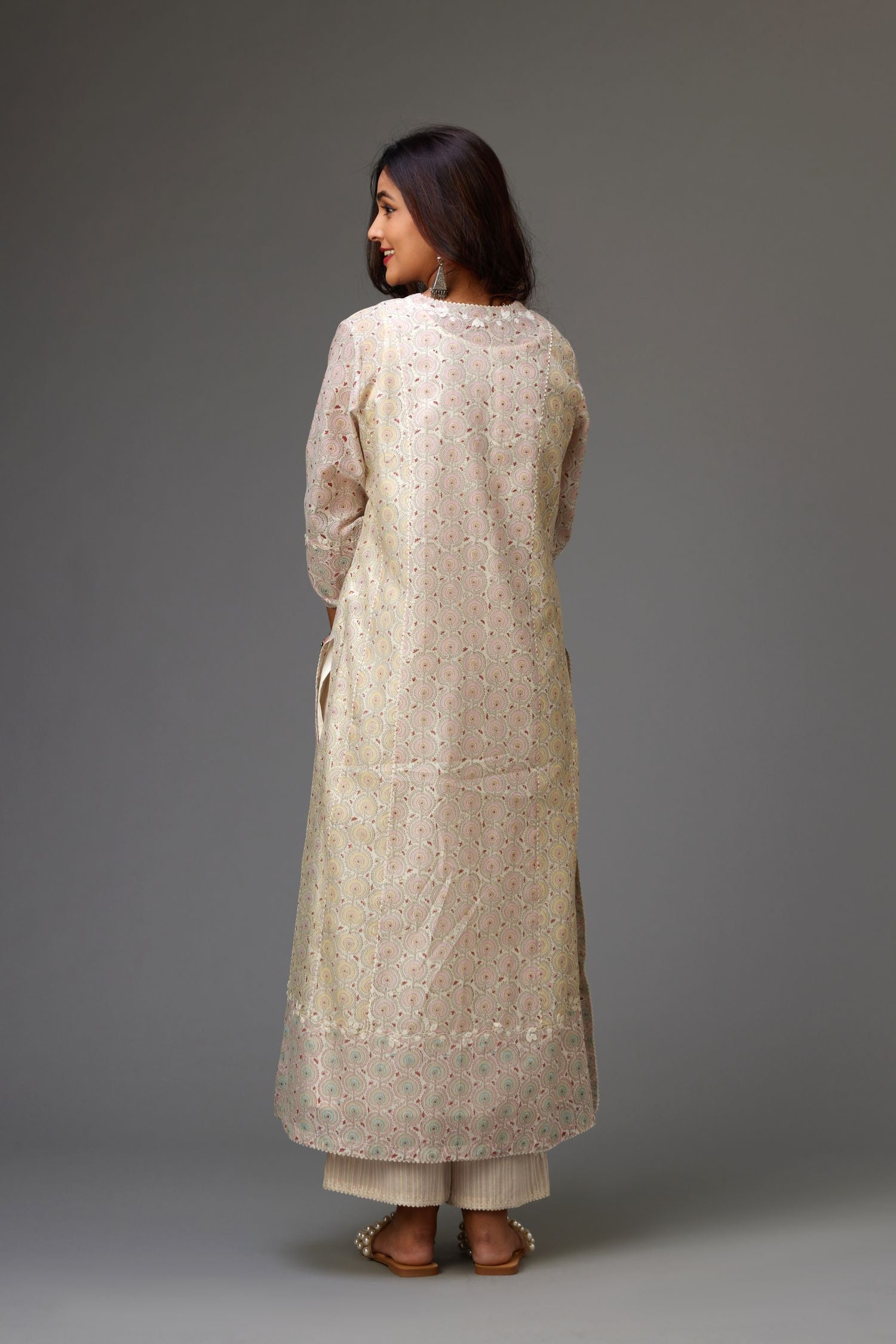 Silk Chanderi hand-block printed kurta set with multi-print panels, highlighted with white thread embroidery and chiffon flowers.