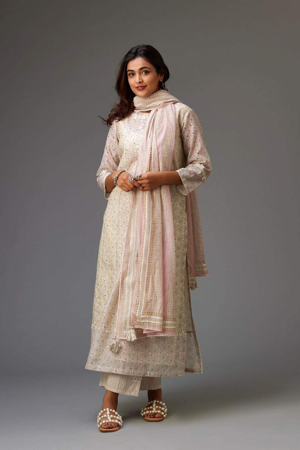 Silk Chanderi hand-block printed kurta set with multi-print panels, highlighted with white thread embroidery and chiffon flowers.
