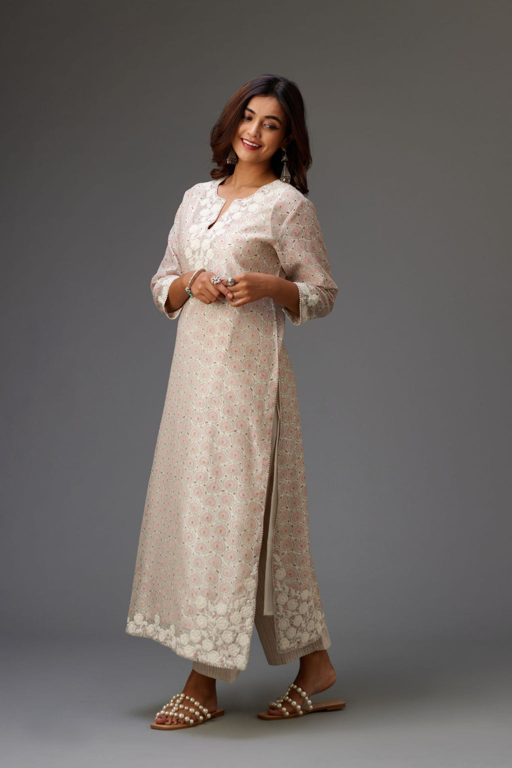 Pink and grey Silk Chanderi hand-block printed kurta set with appliqué embroidery, highlighted with lace and sequins.