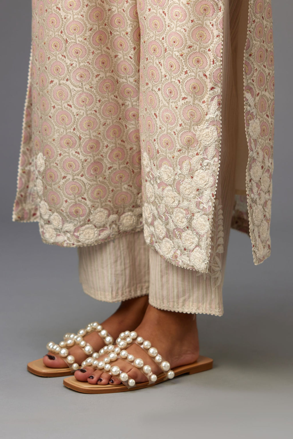 Pink and grey Silk Chanderi hand-block printed kurta set with appliqué embroidery, highlighted with lace and sequins.