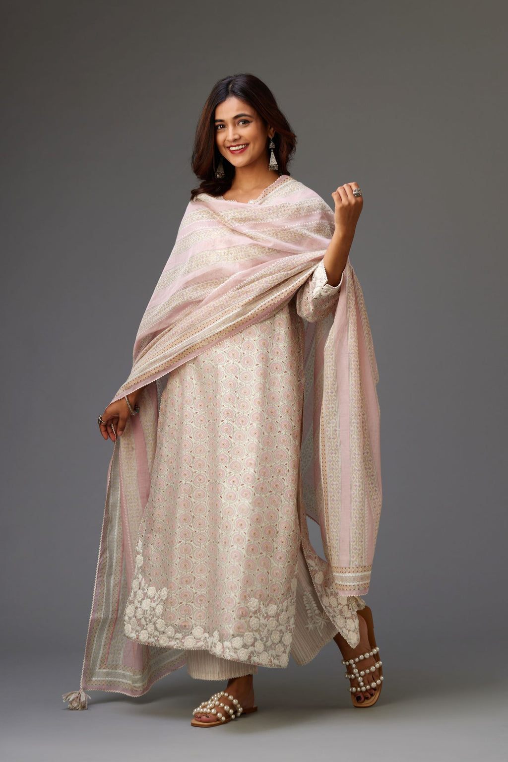 Pink and grey Silk Chanderi hand-block printed kurta set with appliqué embroidery, highlighted with lace and sequins.
