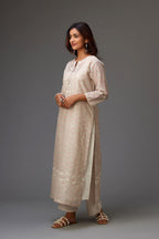 Silk chanderi hand-block printed straight kurta set with sequins work and chiffon flower embroidery.