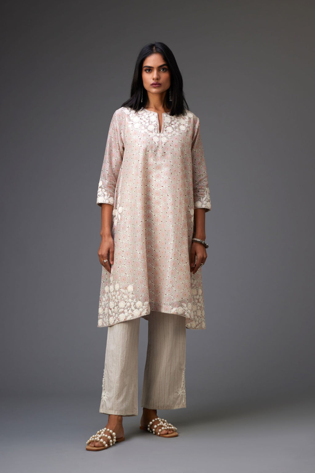 Pink & grey hand block printed short A-line kurta set with appliqué embroidery, highlighted with ric rac lace and sequins.