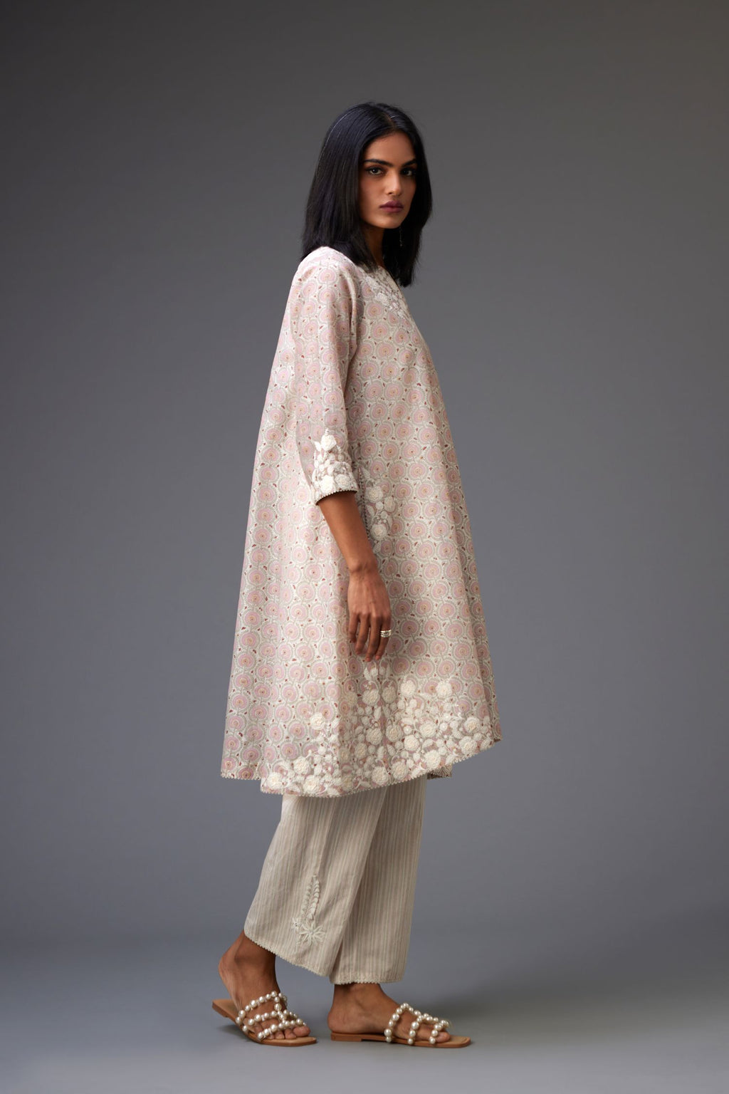 Pink & grey hand block printed short A-line kurta set with appliqué embroidery, highlighted with ric rac lace and sequins.