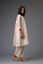 Pink & grey hand block printed short A-line kurta set with appliqué embroidery, highlighted with ric rac lace and sequins.