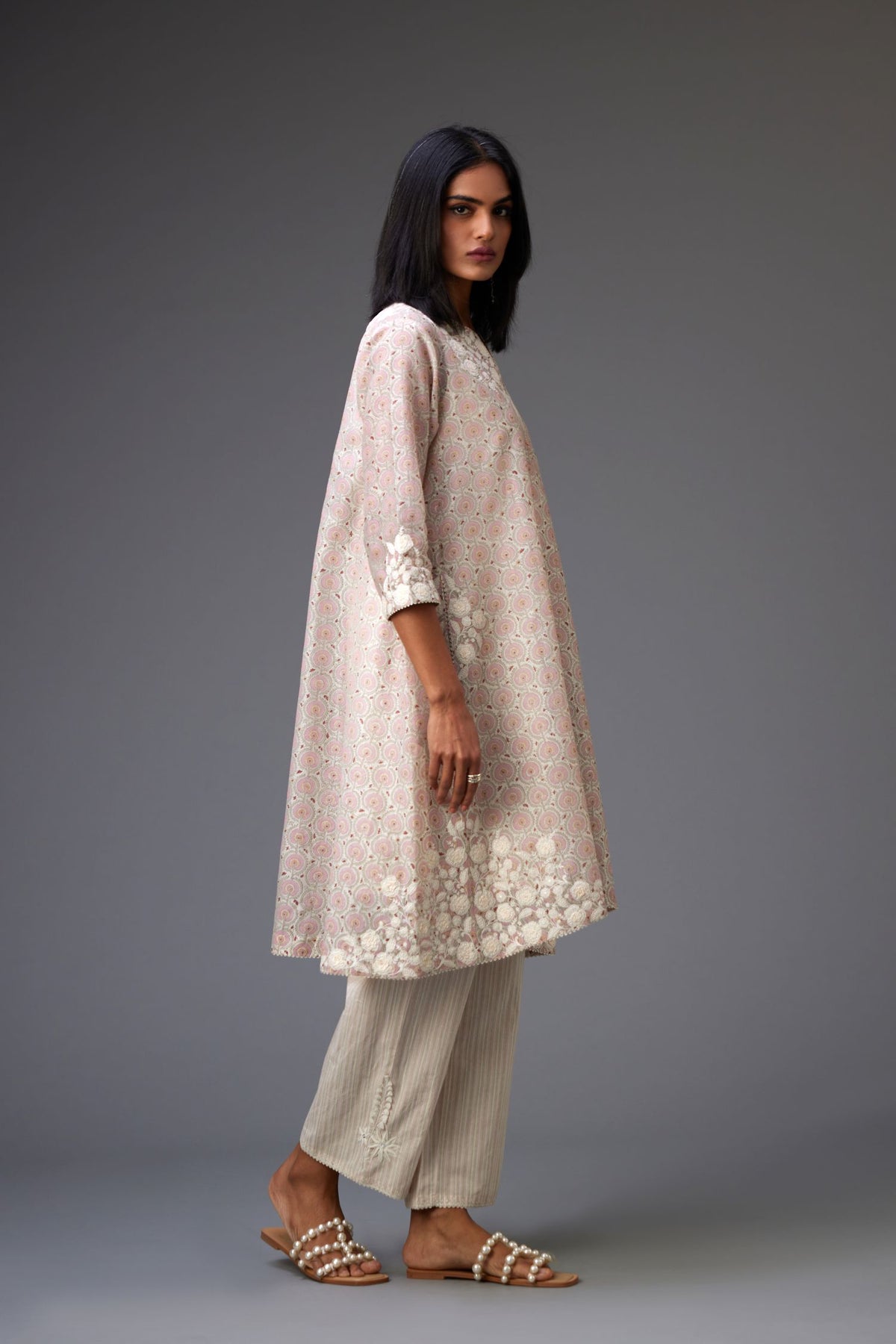 Pink & grey hand block printed short A-line kurta set with appliqué embroidery, highlighted with ric rac lace and sequins.