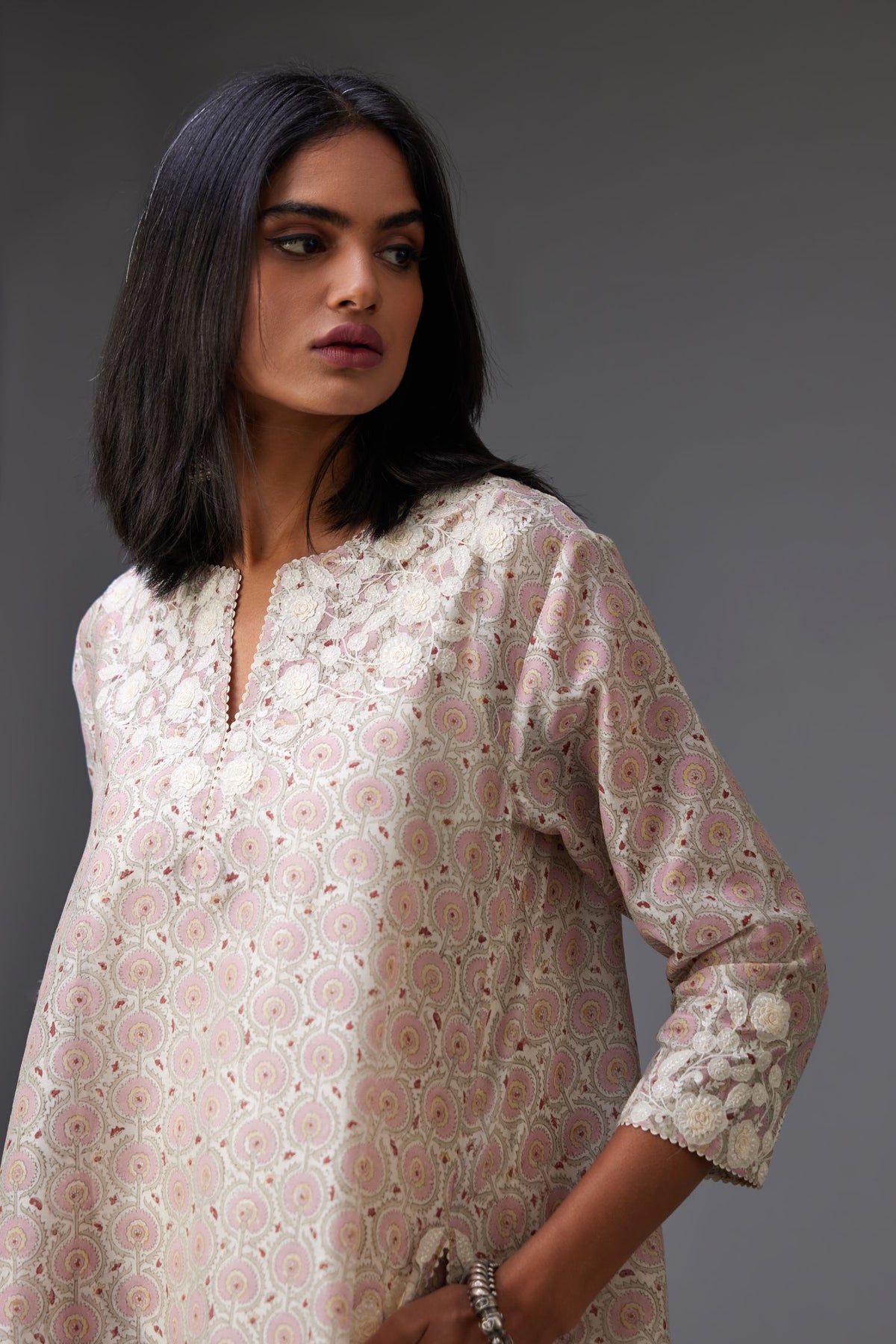 Pink & grey hand block printed short A-line kurta set with appliqué embroidery, highlighted with ric rac lace and sequins.