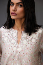 Pink & grey hand block printed short A-line kurta set with appliqué embroidery, highlighted with ric rac lace and sequins.