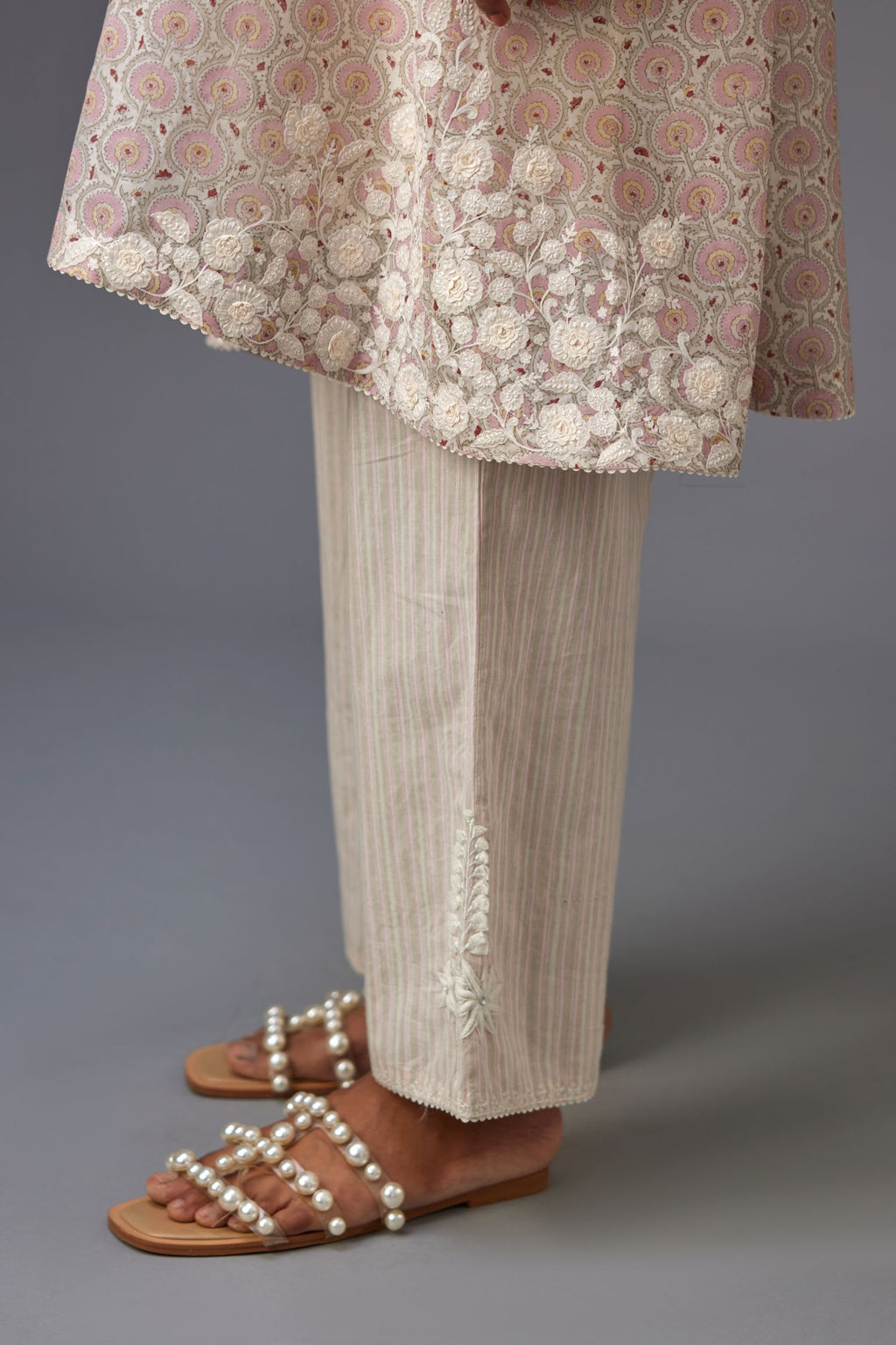 Pink & grey hand block printed short A-line kurta set with appliqué embroidery, highlighted with ric rac lace and sequins.