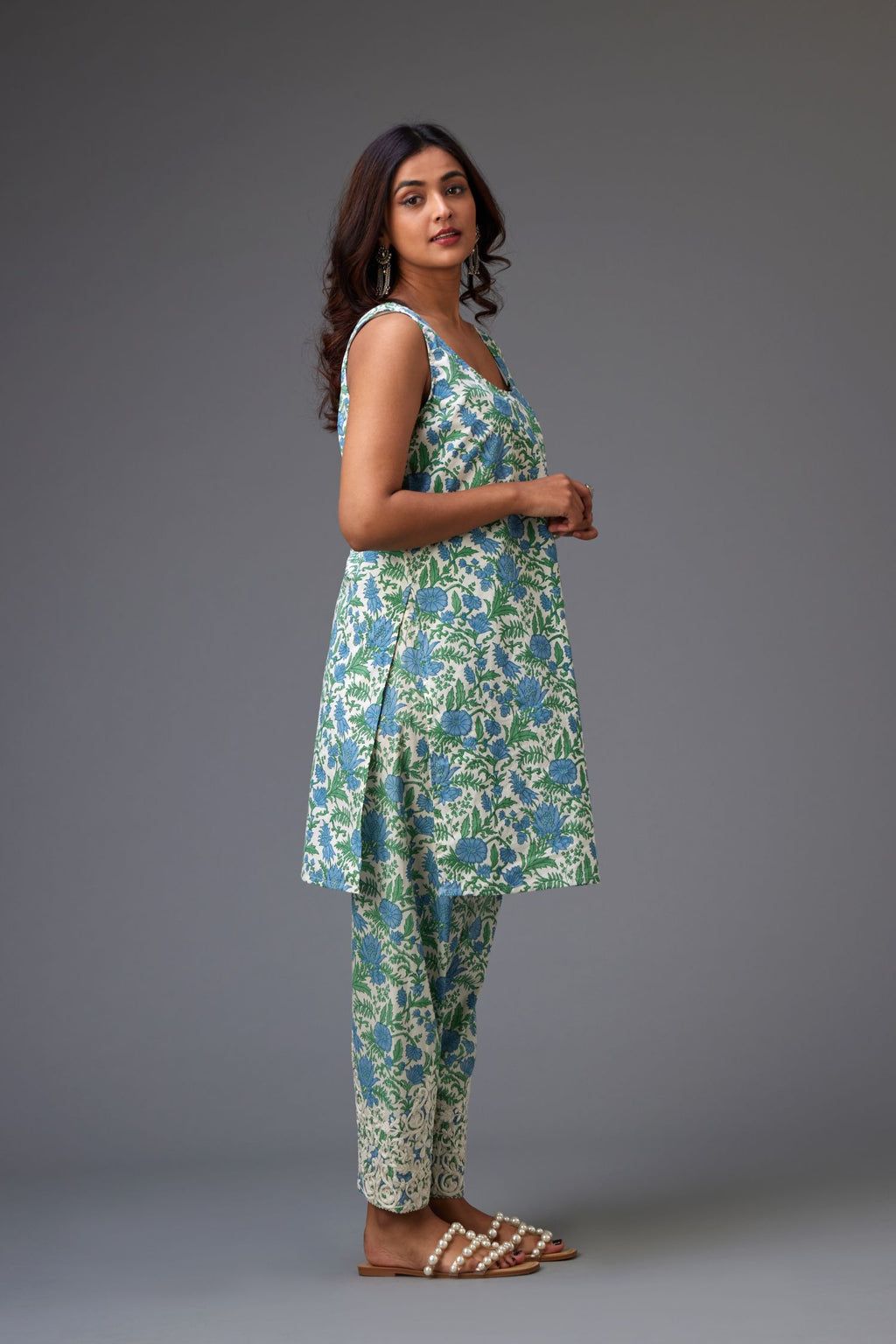 Off-white silk chanderi short kurta set with all-over assorted embroidered flowers, highlighted with sequins handwork.