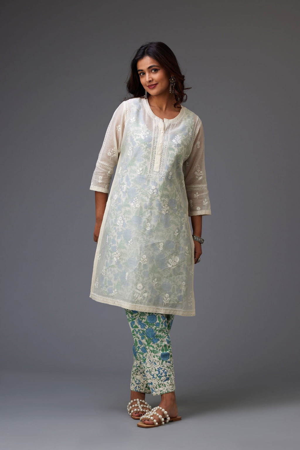 Off-white silk chanderi short kurta set with all-over assorted embroidered flowers, highlighted with sequins handwork.