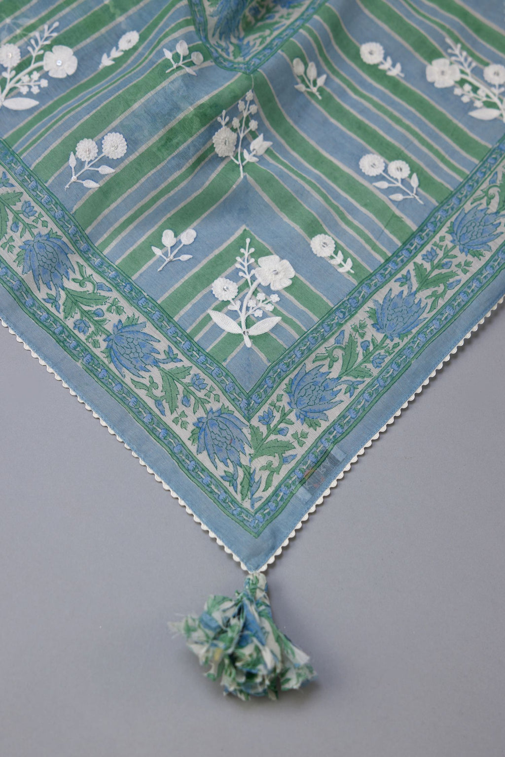 Blue & green hand block printed dupatta with all over assorted flower embroidery, finished with ric rac lace.