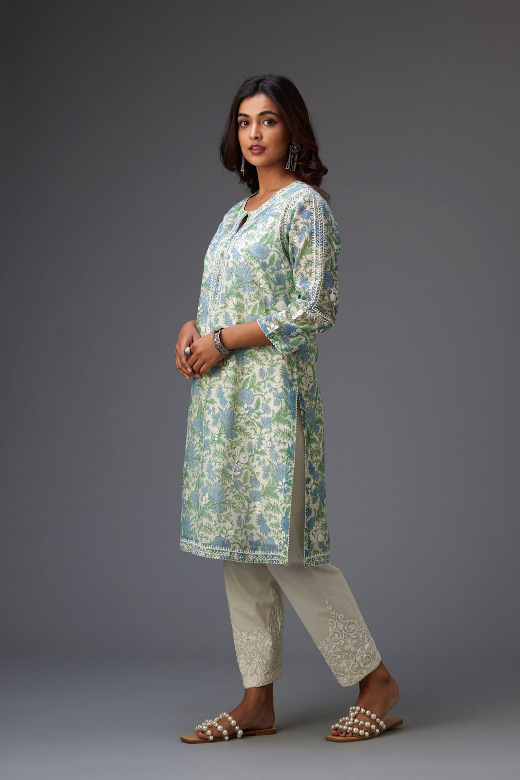 Blue and green hand block printed cotton chanderi short kurta set with all-over assorted embroidered flowers, highlighted with sequins handwork.
