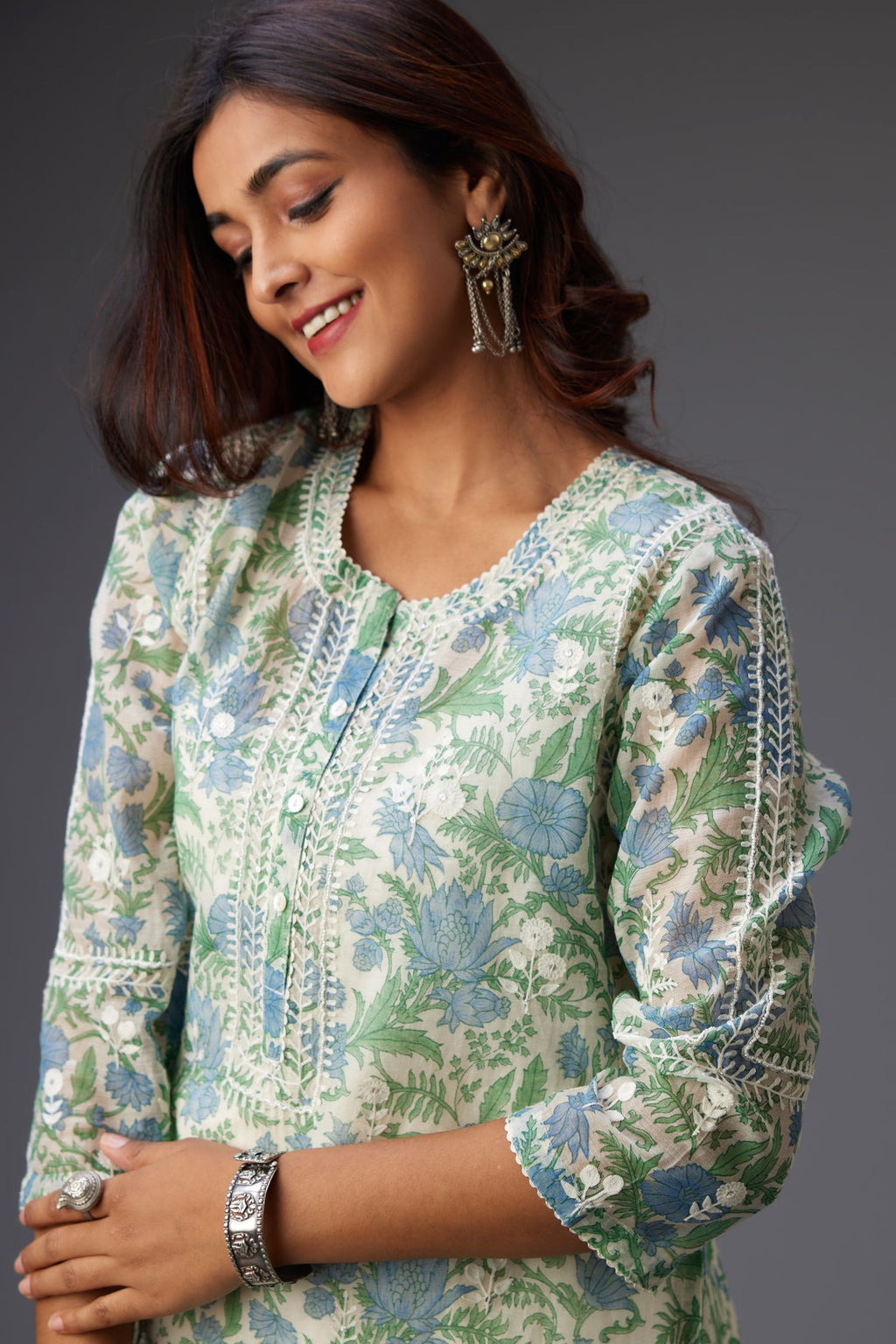 Blue and green hand block printed cotton chanderi short kurta set with all-over assorted embroidered flowers, highlighted with sequins handwork.