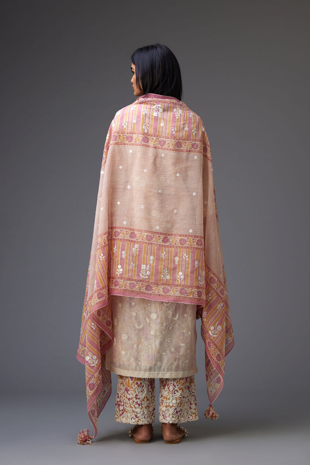 Pink and mustard hand block printed dupatta with all over assorted flower embroidery, finished with ric rac lace.