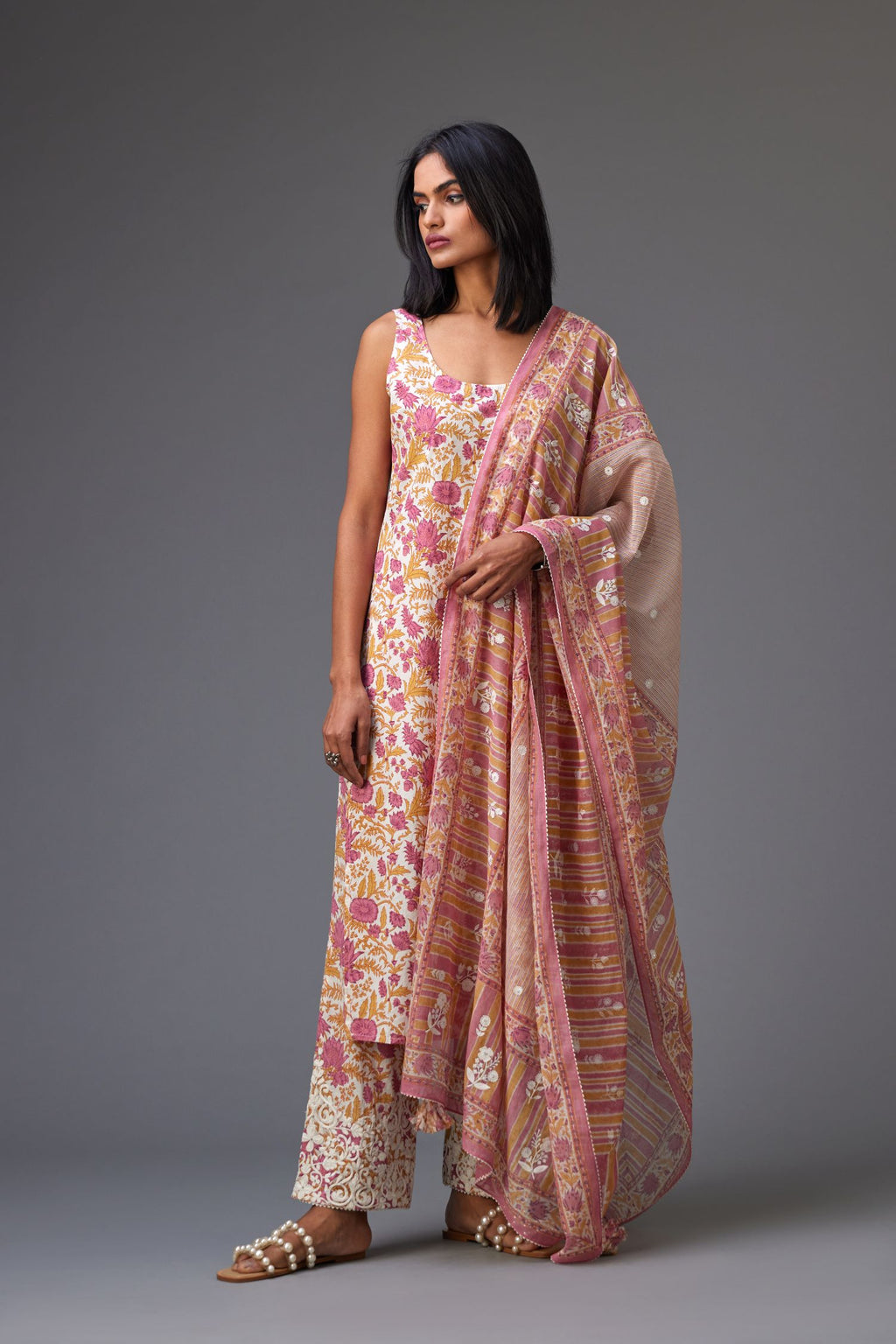 Pink and mustard hand block printed dupatta with all over assorted flower embroidery, finished with ric rac lace.
