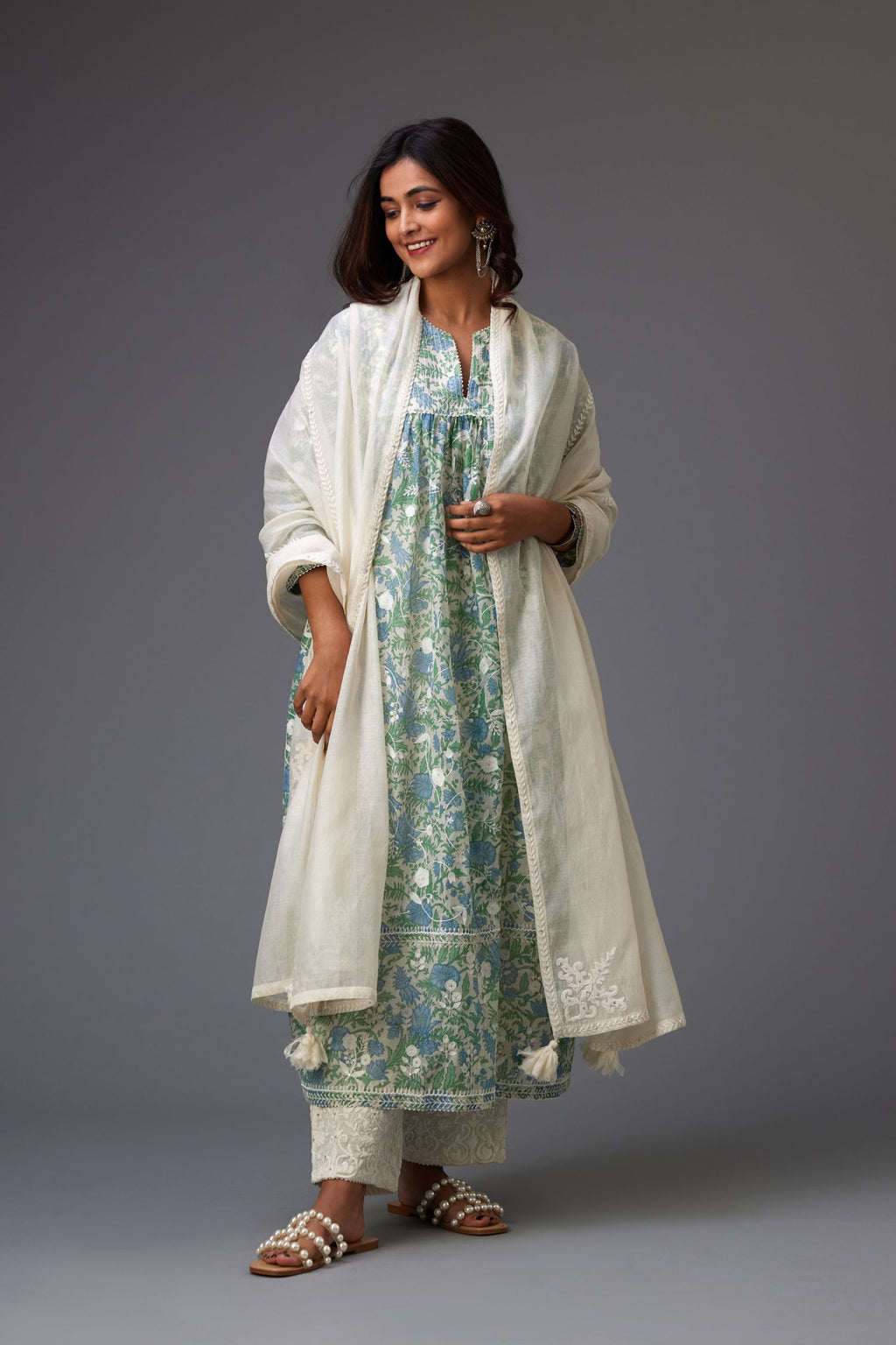 Off-white cotton chanderi dupatta with white dori embroidered border and bootas at all four corners.