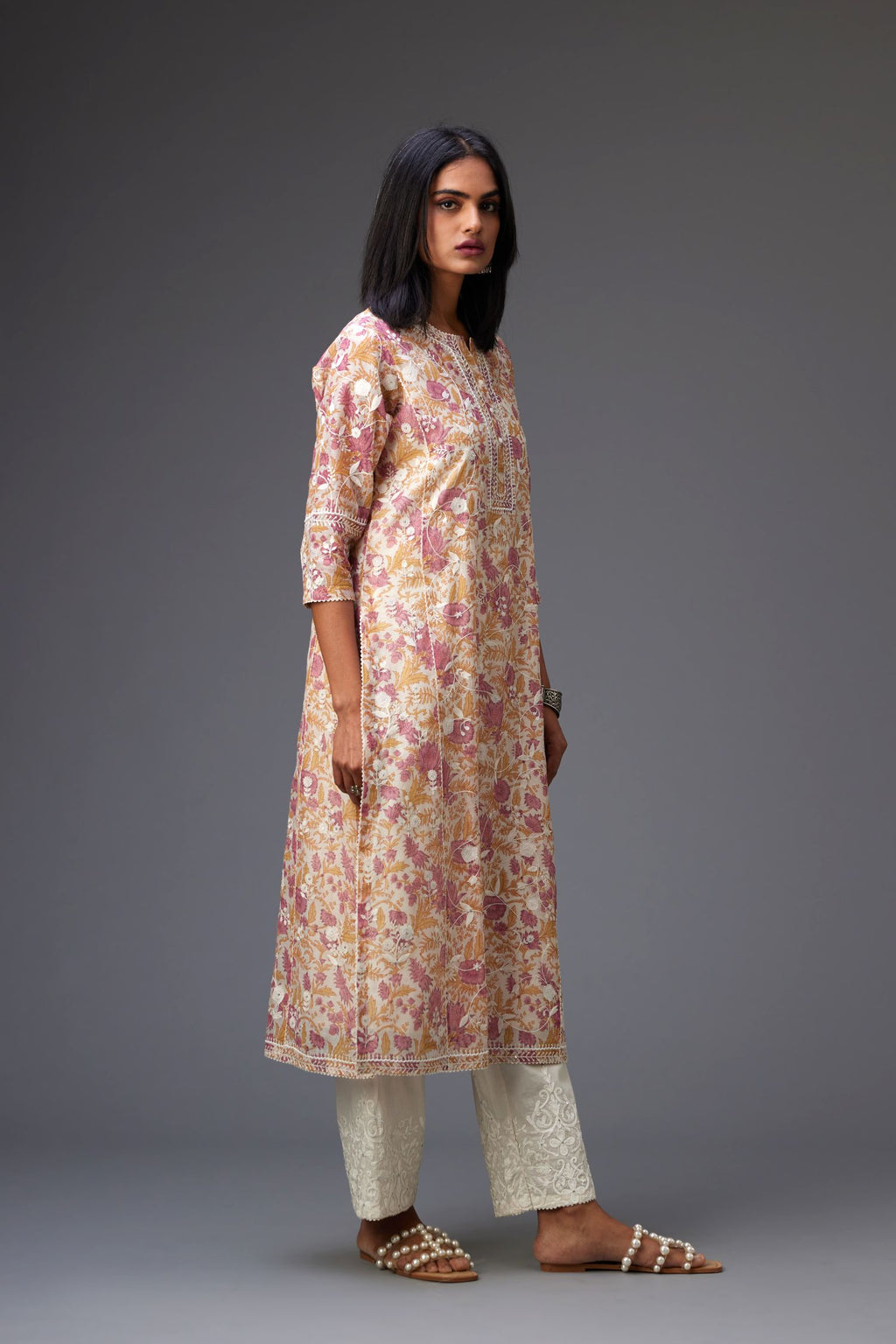 Pink and mustard hand block printed cotton chanderi kurta set with all-over jaal embroidery and small assorted flowers embroidery at side panells, highlighted with sequins handwork.