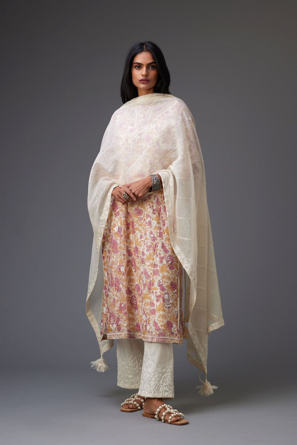 Off-white cotton chanderi dupatta with dori embroidery border at the edges and diagonal thread embroidered lines all-over the dupatta.