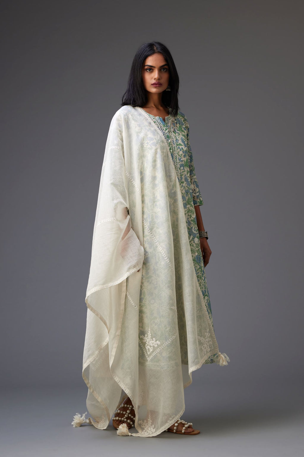 Blue and green hand block printed cotton chanderi kurta set with all-over jaal embroidery and small assorted flowers embroidery at side panells, highlighted with sequins handwork.