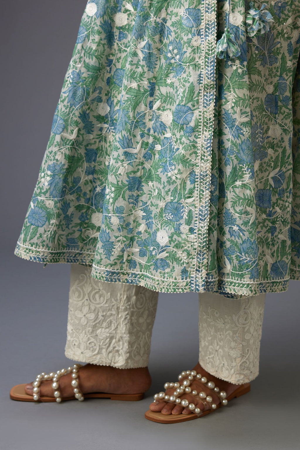 Blue and green hand block printed angrakha kurta set with white thread embroidery and sequins work all over.