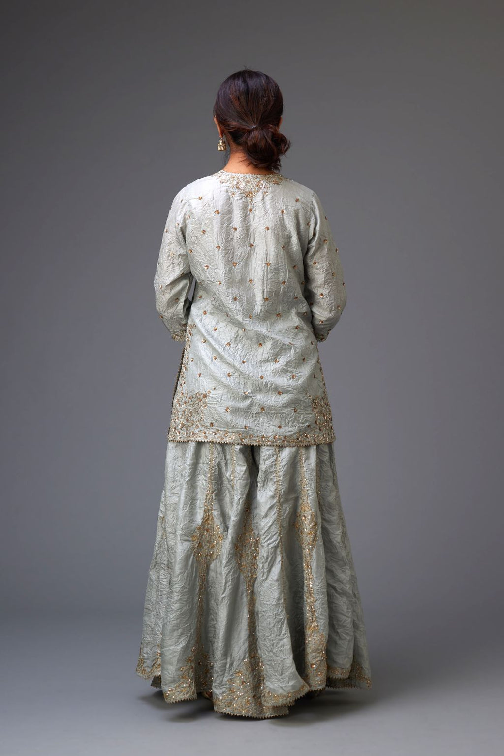 Blue hand crushed silk short kurta set with all-over gold sequins and zari handwork, highlighted with gota lace at edges.