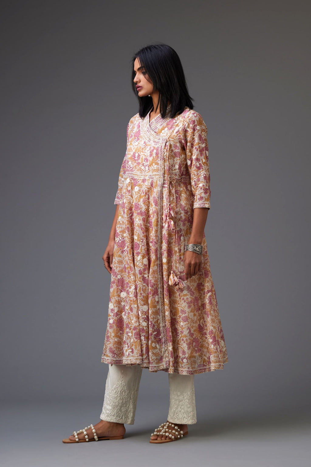 Pink and mustard hand block printed angrakha kurta set with white thread embroidery and sequins work all over.