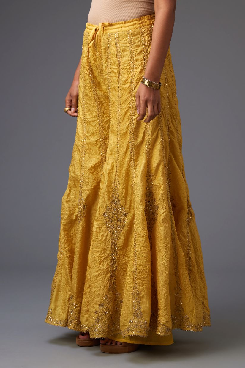 Yellow silk farshi with all-over sequins and zari work.