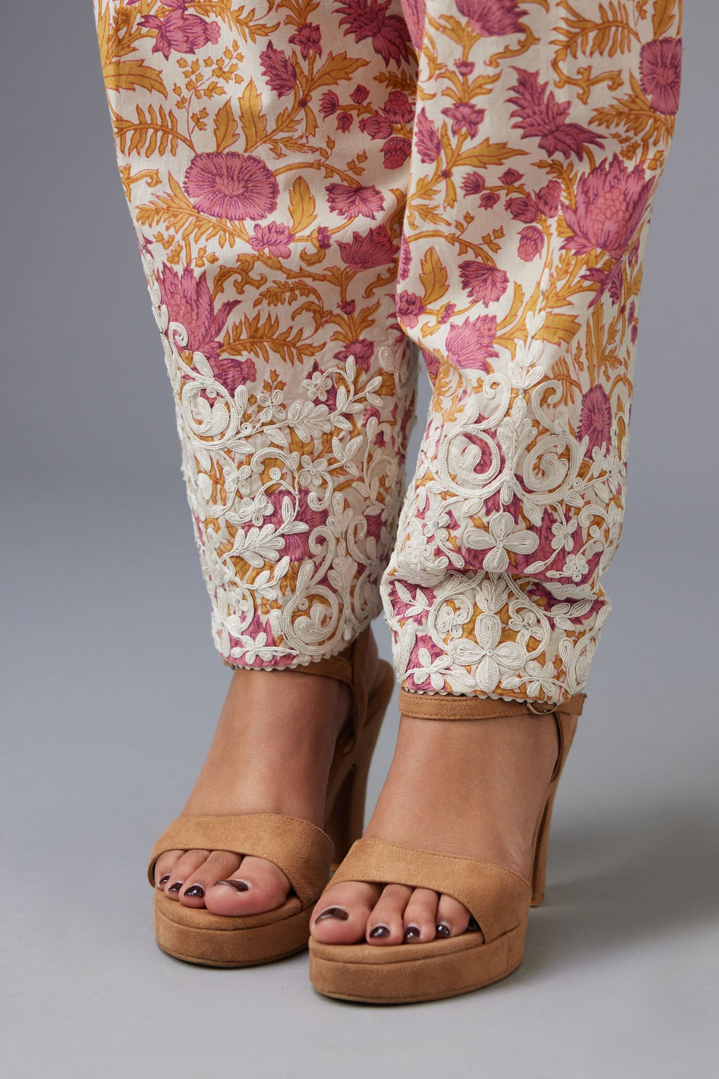 Pink and mustard hand block printed salwar with dori embroidery at hem, highlighted with ric rac.
