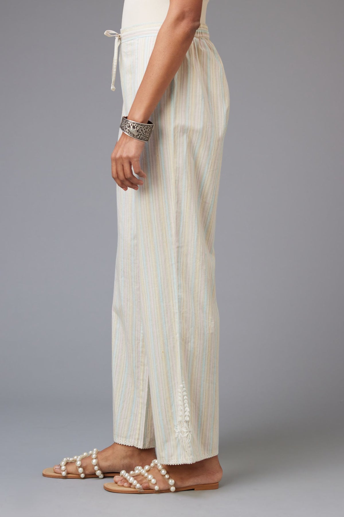 Multi printed stripe Cotton straight pants with a chiffon embroidered boota at the hem.