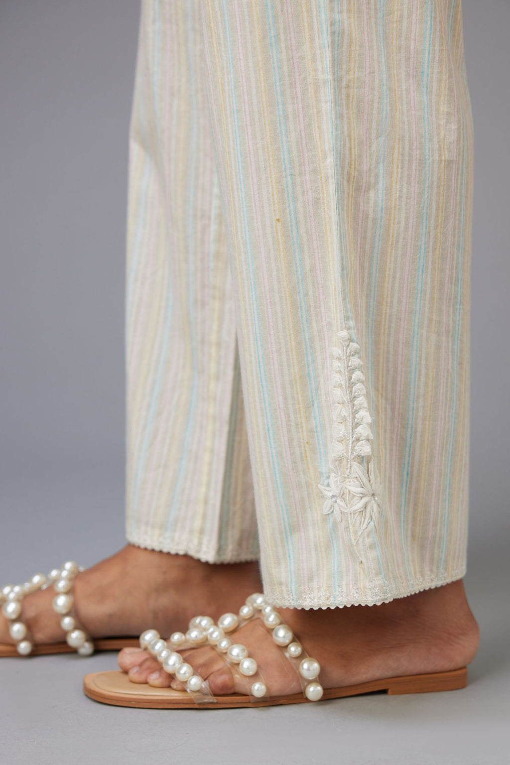 Multi printed stripe Cotton straight pants with a chiffon embroidered boota at the hem.